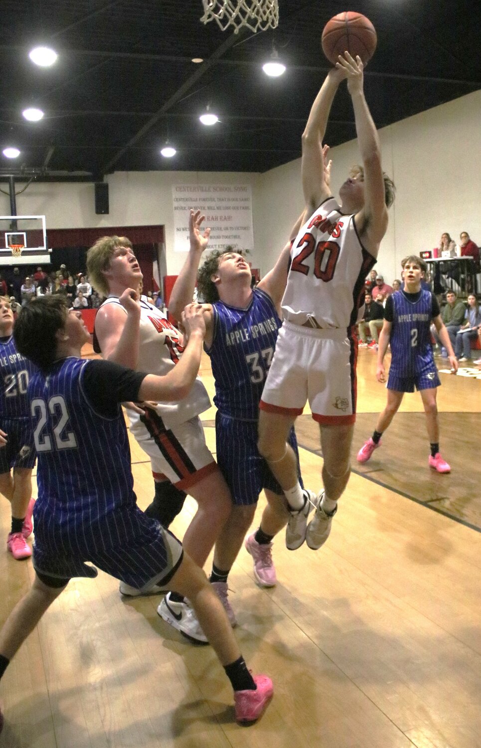 Centerville’s Braden White (No. 20) puts up the layup.