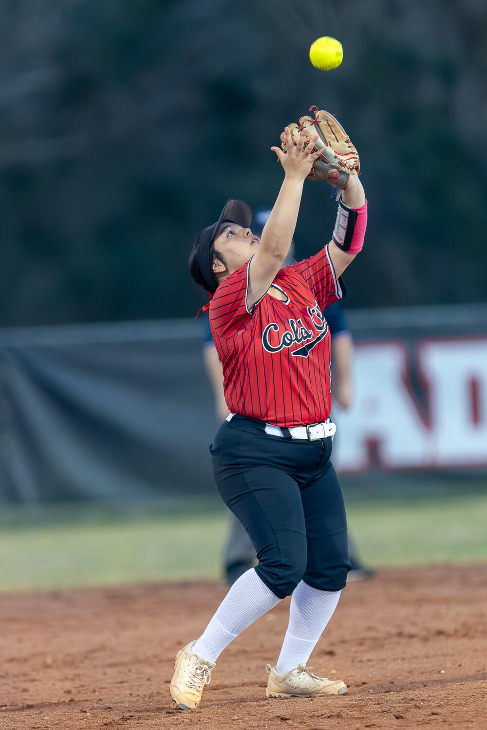Jasper Williams grabs and infield fly for another out against the Tarkington Lady Horns.