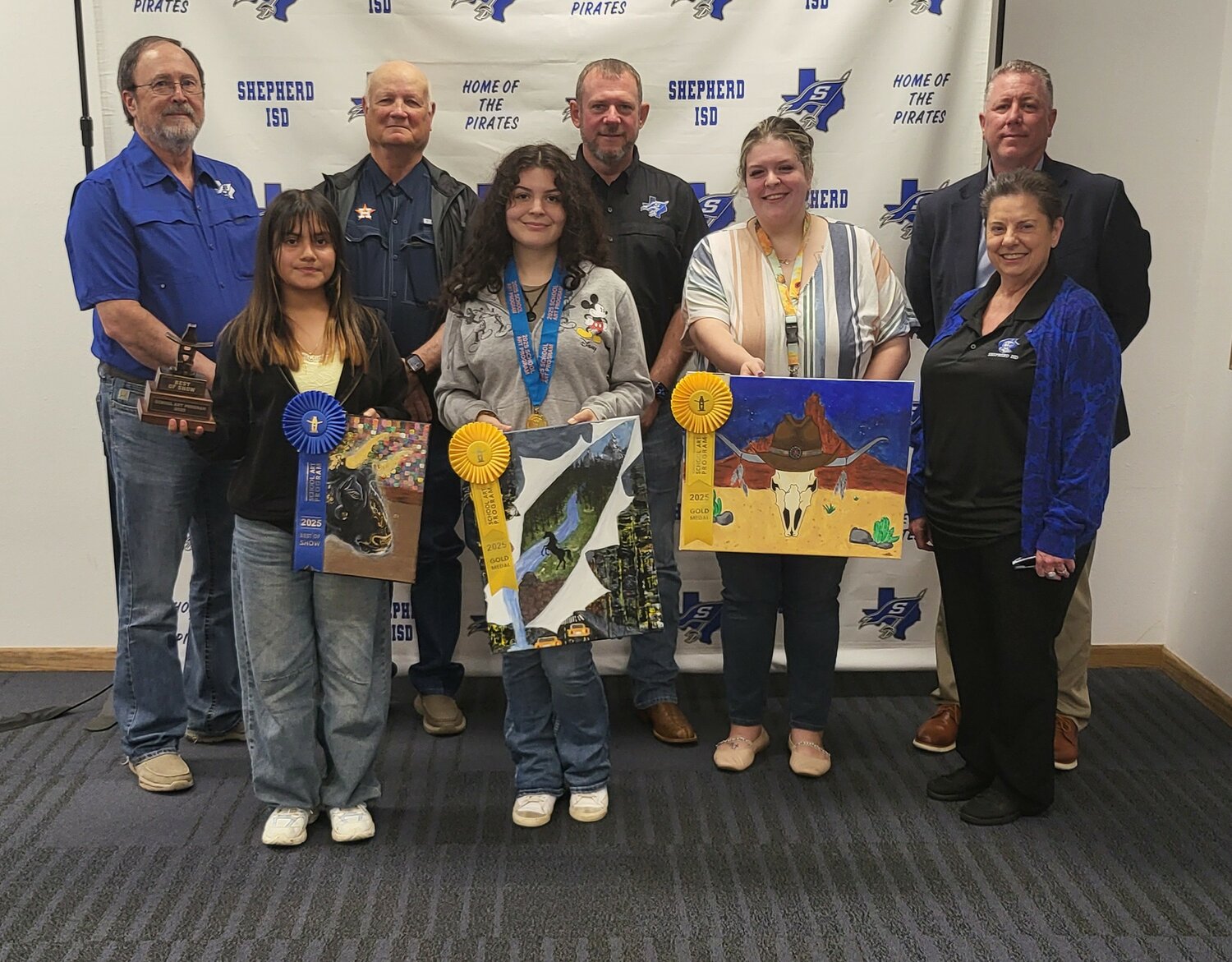 The Shepherd ISD Board of Managers recognized Houston Livestock and Rodeo Art Contest winners Sarya Contreras, Darwin Meza and Kimberly Arteaga.