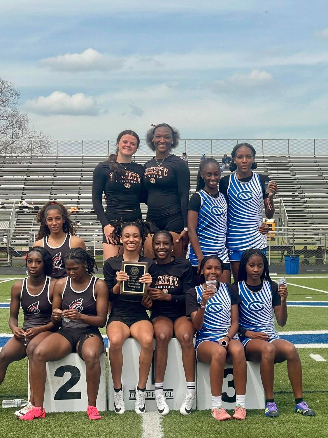 The Trinity girls 800-meter relay team took the championship medal at the district track meet.
