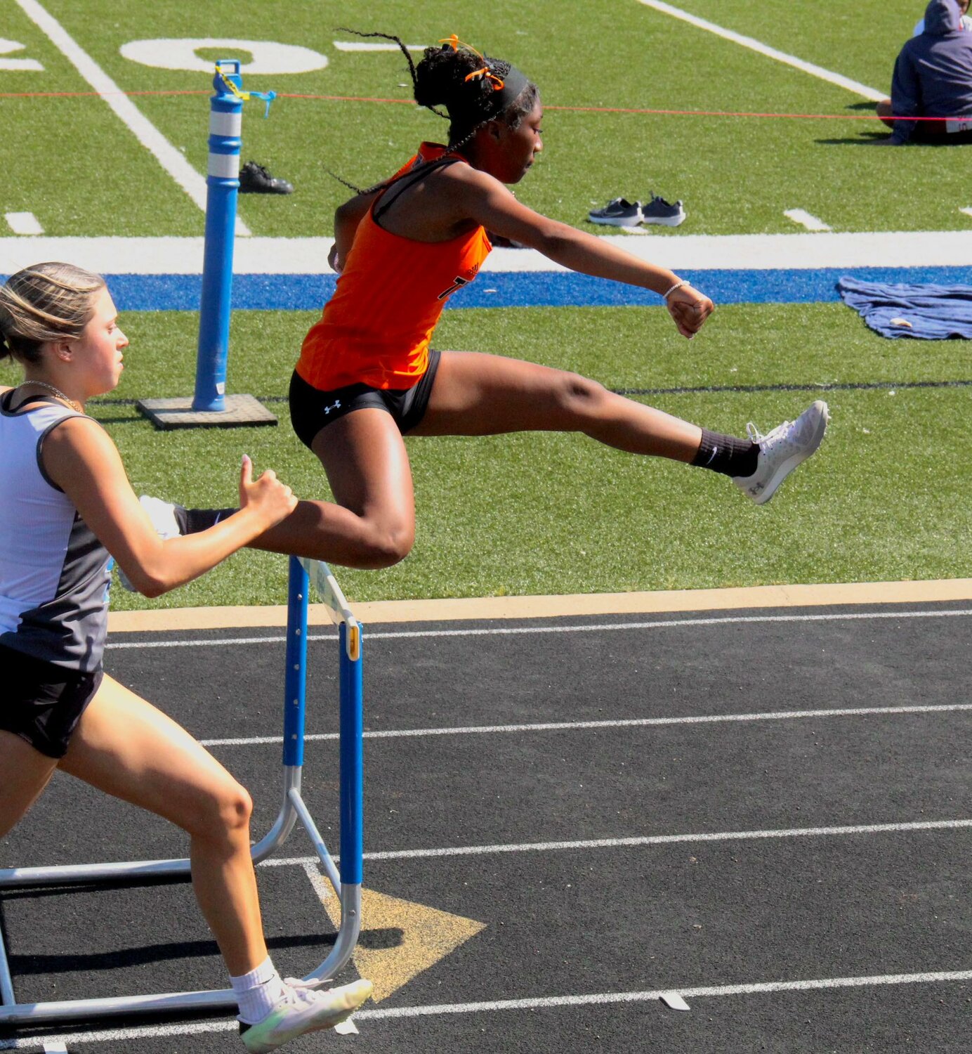 Paris King leaps her way to a second-place finish in the 300 hurdles.