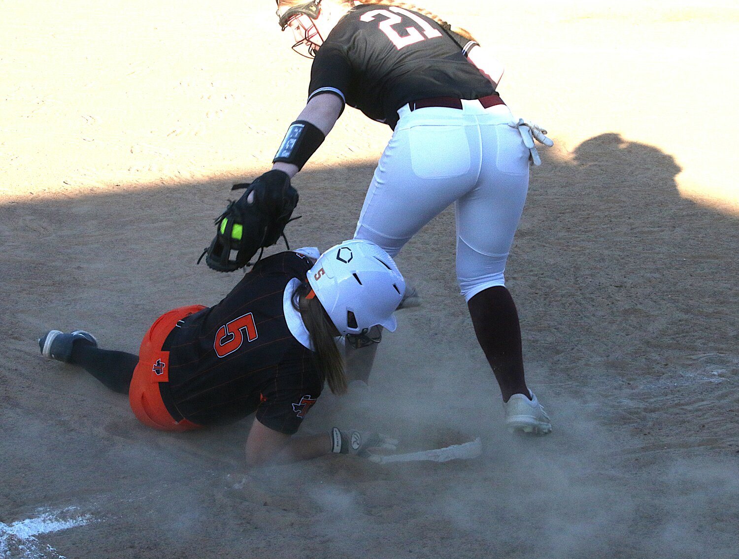 Chrissie Vaughn gets under the tag, stealing third base.