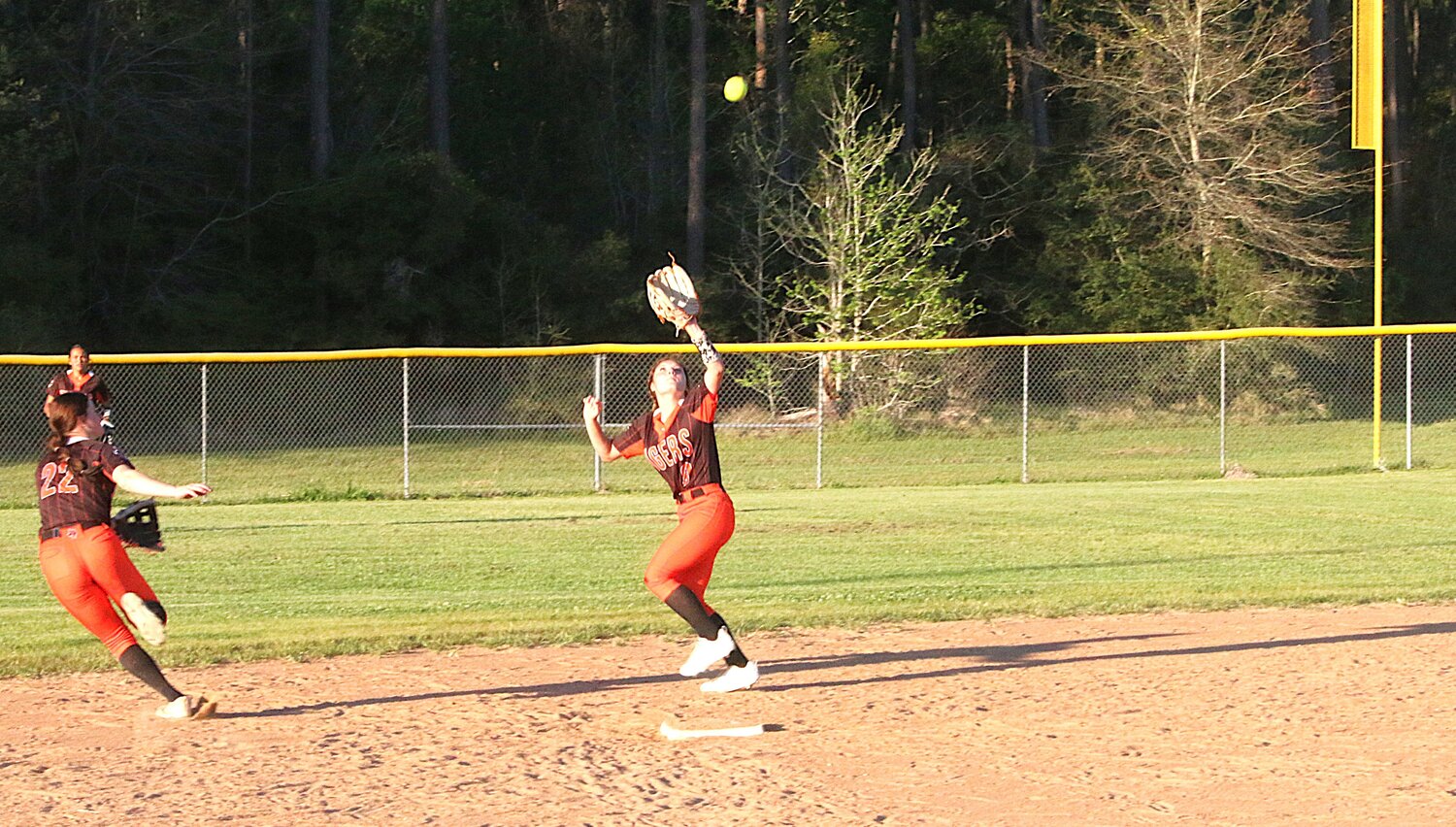 Maddie May hauls in the pop fly at second base.