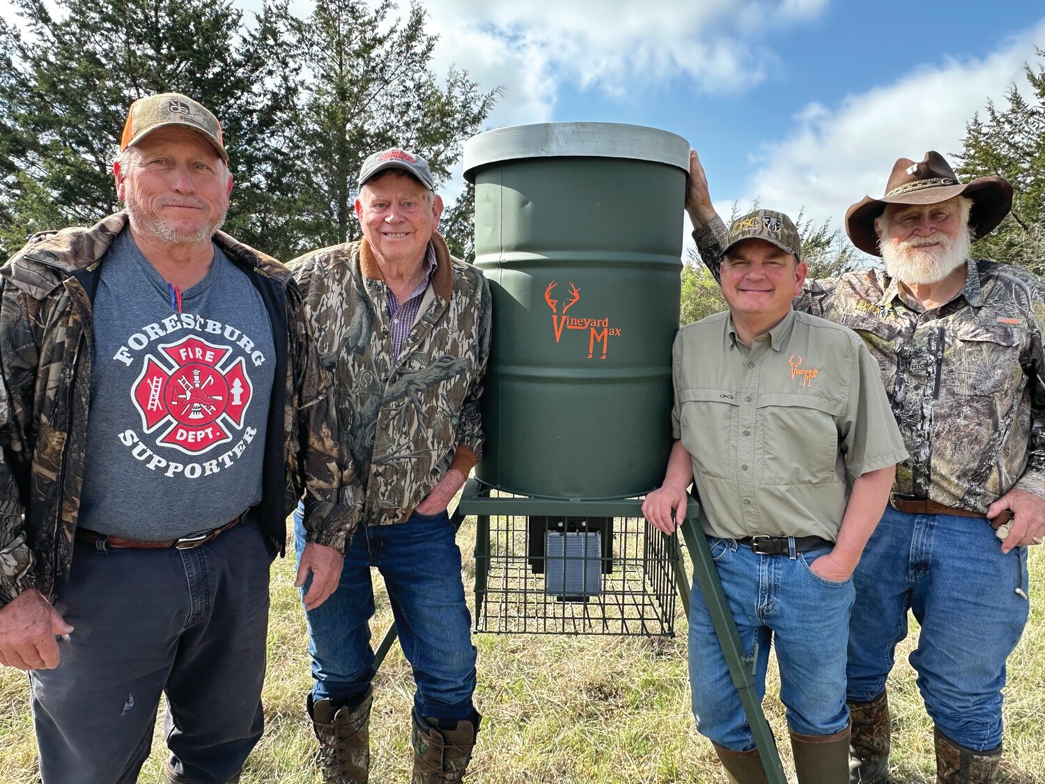 Setting up a Vineyard Max deer feeder on the Gresham Ranch after a bit of scouting.  PHOTO BY LUKE CLAYTON