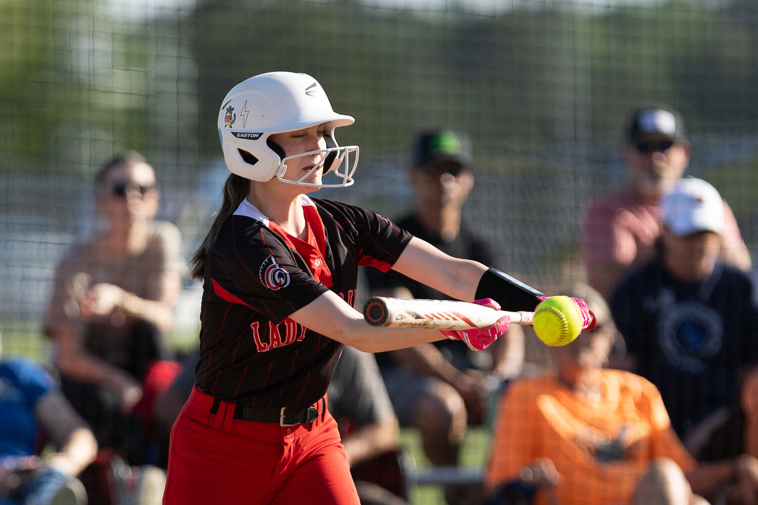 Addison Headley lines up for a bunt during the district matchup with Trinity.