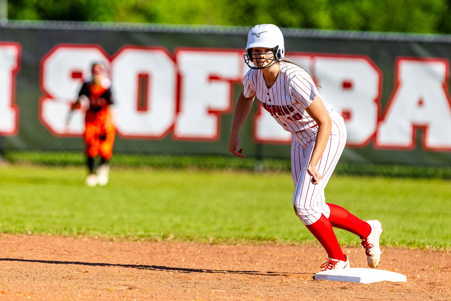 Ella Phillips prepares to steal second base during the game against the Lady Tigers.
