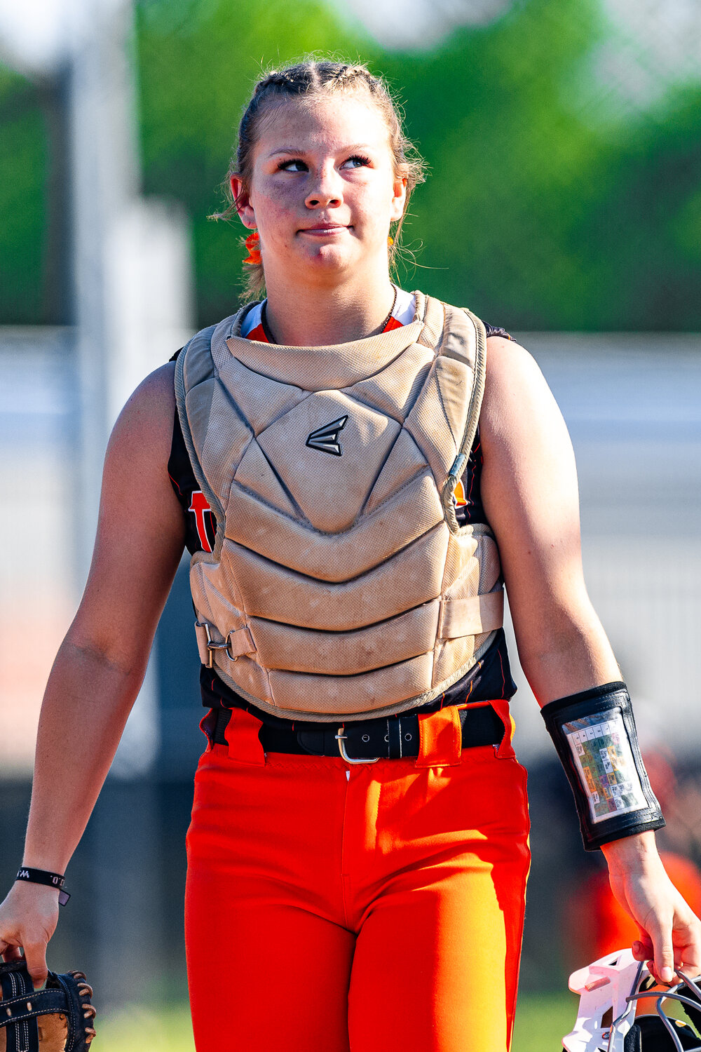 Catcher for the Lady Tigers, Chrissie Vaughn, sizes up the game against the Lady Trojans.