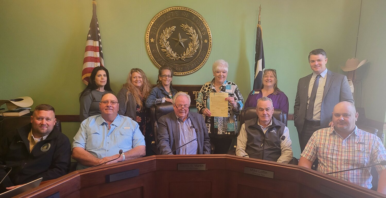 Members of the Trinity County Commissioners Court and representatives of SAAFE House display the proclamation designating April as Sexual Assault Awareness Month.