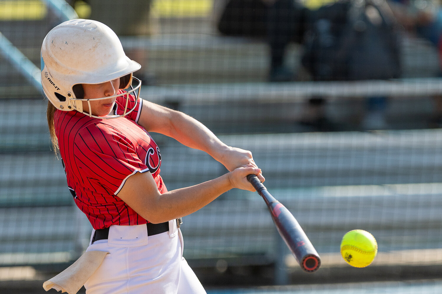 Trinity Rosales tags a fast ball and sends it deep into the outfield against the Onalaska Lady Wildcats.