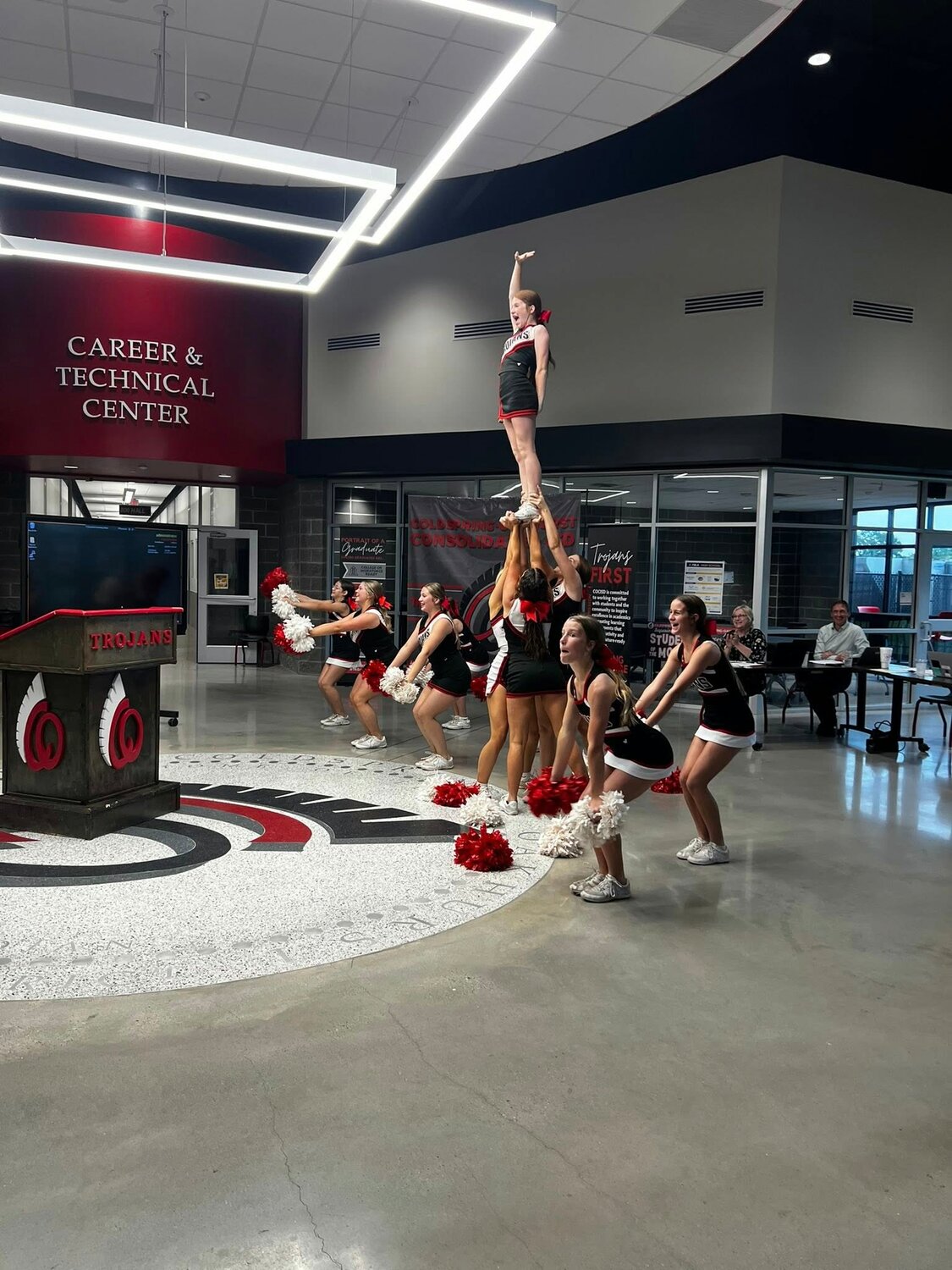 The Trojan Cheer Squad performs for the COCISD Board of Trustees.