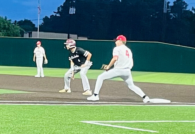Jake Gibson takes a lead off first base.