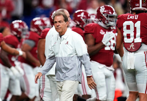 FILE - Alabama coach Nick Saban watches players warm up for the College Football Playoff championship NCAA football game against Georgia on Jan. 10, 2022, in Indianapolis. Saban called out Texas A&amp;M on Wednesday night, May 18 for &ldquo;buying&rdquo; players in its top-ranked recruiting class with name, image and likeness deals, saying Crimson Tide football players earned more than $3 million last year &ldquo;the right way.&rdquo; (AP Photo/Paul Sancya, File)