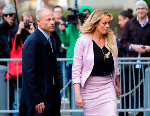 FILE - In this April 16, 2018 file photo, Stormy Daniels, right, and her attorney Michael Avenatti turn from the microphones after speaking as they leave federal court in New York. California lawyer Michael Avenatti wants leniency at sentencing for defrauding former client Stormy Daniels of hundreds of thousands of dollars, his lawyers say, citing a letter in which he told Daniels: &ldquo;I am truly sorry.&rdquo; The emailed letter, dated May 13, was included in a submission his lawyers made late Thursday, May 19, 022, in Manhattan federal court in advance of a June 2 sentencing. (AP Photo/Seth Wenig, File)