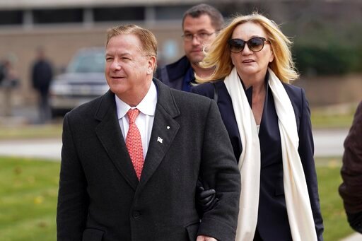 FILE - In this Nov. 16, 2021, file photo, Mark McCloskey, a Republican candidate for U.S. Senate in Missouri, and his wife, Patricia McCloskey, walk outside the Kenosha County Courthouse, in Kenosha, Wis. The Missouri Supreme Court denied a request by U.S. Senate candidate Mark McCloskey and his wife to give free legal advice to a conservative activist group as a condition of their probation, but McCloskey said Thursday, May 19, 2022 he'll try to find another right-wing organization to represent. (AP Photo/Paul Sancya, File)