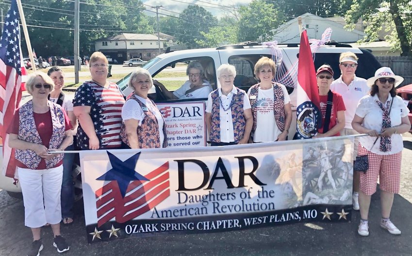 Members of the West Plains Ozark Spring chapter of the National Society Daughters of the American Revolution participating in the Willow Springs 4th of July parade, from left: Robbie Anderson, Madeline Taylor, Rebekah McKinney, Jan Tappana, Blanche McKinney, Karen Ryburn, Lois Frazier, Nyalin Barnes, Cindy McKee-Pirch and&nbsp;Connie Weber.