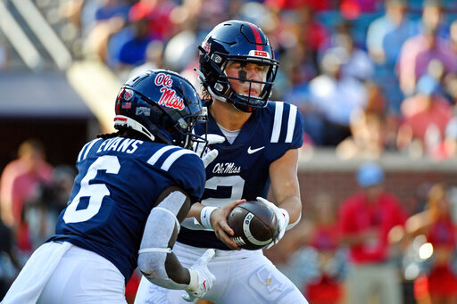 Mississippi quarterback Jaxson Dart (2) hands the ball off to running back Zach Evans (6) during the first half of an NCAA college football game against Tulsa in Oxford, Miss., Saturday, Sept. 24, 2022. (AP Photo/Thomas Graning)