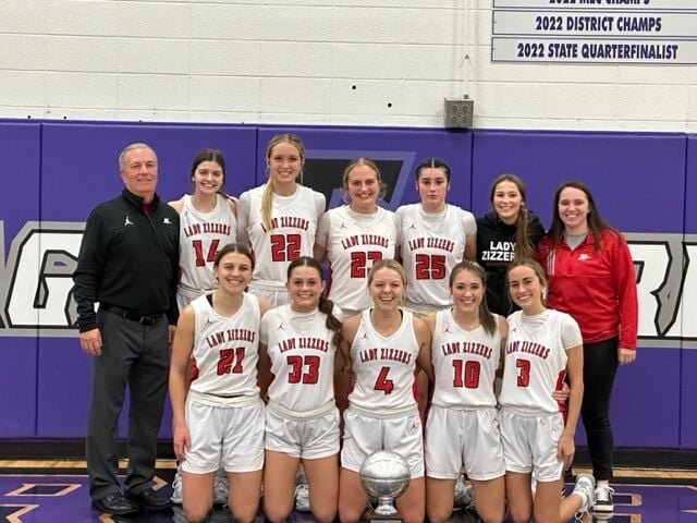 The WPHS Lady Zizzers hoisted the championship trophy Friday night at the Fair Grove Invitational Tournament. Front row, from left: Drew Harris, Hannah Judd, Zoey Williams, Kaylea Dixon, and Mary Claire Gohn. Second row: Coach Womack, Emily Dawson, Allyssa Joyner, Madi Hughston, Olivia Lawson, team manager Kaitlyn Murphy, and assistant coach Hailee Erickson.