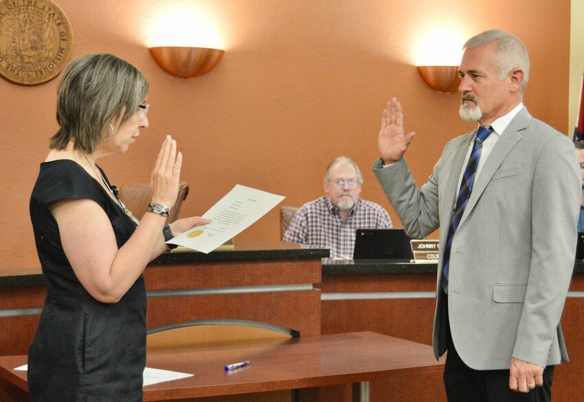 Councilman Greg Collins, right, was sworn in and started his inaugural term Monday evening, filling a seat vacated by Josh Cotter. During Monday&rsquo;s special session, Collins was delegated as the council&rsquo;s representation on the city Parks and Recreation Board. Administering the oath of office is City Clerk Allison Skinner.