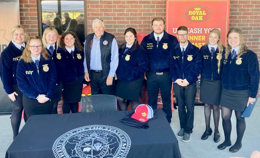 The West Plains FFA traveled on Tuesday to Jefferson City for an opportunity to stand alongside Gov. Mike Parson and Sen. Karla Eslinger for the historic signing of Senate Bill 138, which focuses heavily on agricultural support, including a provision for a tax credit for farmers who sell, lease or participate in a crop-share agreement with a beginning farmer and a fund to promote Missouri hardwood forest products. West Plains FFA Adviser Tonya Jedlicka pointed out forestry is a significant industry in West Plains and Howell County as a whole. &ldquo;Most FFA students are directly involved with forest production and we hope this bill increases or expands the Missouri hardwood market which will eventually provide more opportunities for our youth,&rdquo; she explained. She pointed out the legislation also addresses veterinarian student loan repayment programs to encourage more interest in the occupation.&nbsp;Taking time for a photo after the bill was signed into law are, from left, FFA students Morgan Beukers, Leah French, Malia West and Hallie Bunch; Gov. Parson; and Evy Myers, Cody Jedlicka Jaden Brotherton, Ruby Hinds and Hattie Patillo.