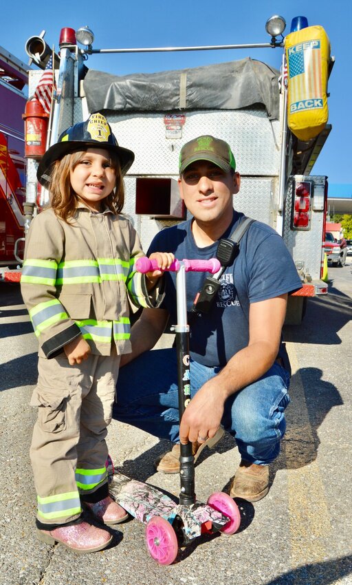 Kaesyn Meltesen, 4 when this photo was taken, took part in the 2022 Howell County Fire Engine Rally dressed out in her own personalized gear and sparkly pink boots. She is the daughter of Howell Rural Fire District No. 1 firefighter Kevin Meltesen, shown with her, and Howell County 911 employee Kalli Meltesen. This year&rsquo;s festivities will take place Oct. 7 in the parking lot of the Greater Ozarks Center for Advanced Technology, 395 E. Broadway in West Plains. All in the community are invited.