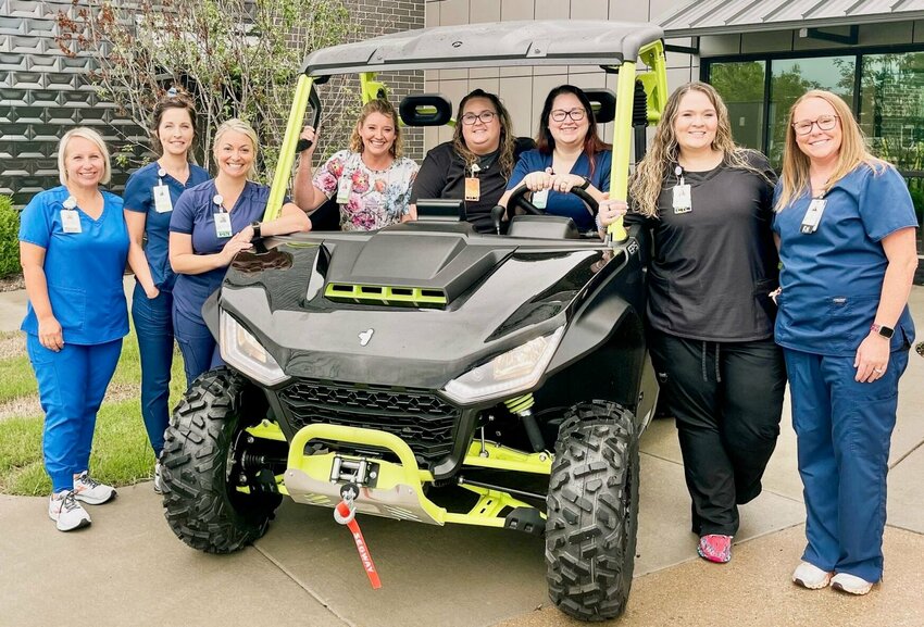 Ozarks Healthcare Cancer Treatment Center staff are pictured with the brand-new, four-wheel-drive Segway Powersport side-by-side that will be given away by drawing by the Ozarks Healthcare Foundation at the 62nd Annual Hootin&rsquo; an&rsquo; Hollarin&rsquo; Festival in Gainesville. All proceeds from ticket sales will go directly to Ozarks Healthcare's Cancer Treatment Center Patient Emergency Fund.