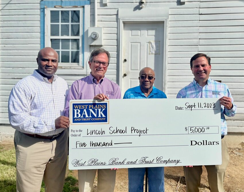 West Plains Bank and Trust Company recently donated $5,000 to the Lincoln School Project. Renovation and fundraising efforts to restore the 103-year-old building are being led by West Plains residents Crockett and Tonya Oaks. The former Black-only school in West Plains will transform into a cultural center for the community. Once complete, the space will serve as a home for events and offer educational resources that honor the building and all it symbolizes. From left: Lincoln School property owner Crockett W. Oaks III, West Plains Bank and Trust Company Board Chairman S. David Gohn, Crockett W. Oaks, Jr., and West Plains Bank and Trust Company President/CEO David M. Gohn.