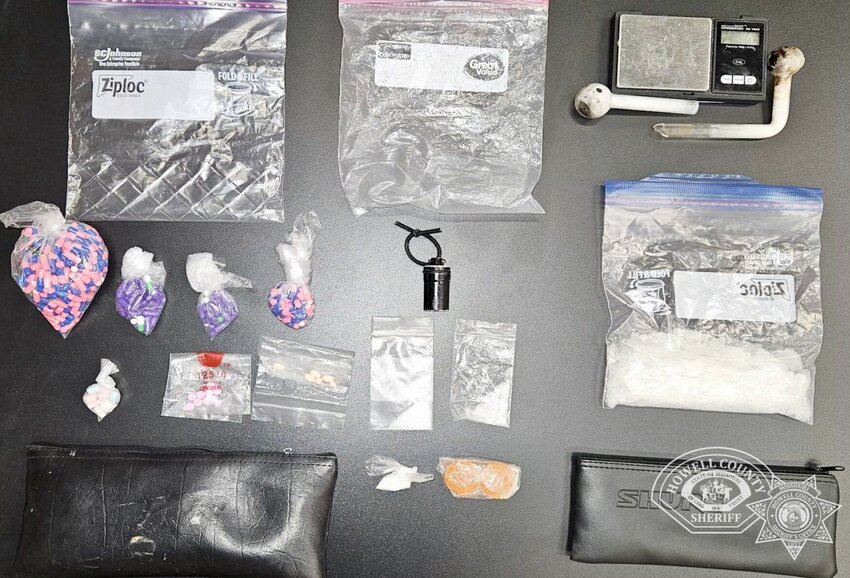 Authorities with multiple agencies recently conducted a search for narcotics at a home on Walnut Street in West Plains, reportedly finding a sizable quantity of drugs, some of which are shown in this photo from the Howell County Sheriff&rsquo;s Office. Substances found reportedly included meth, fentanyl, oxycodone, cocaine, prescription medication and candies of an unknown origin. Jacob N. Biggerstaff has been arrested on drug trafficking and delivery charges relating to the search.
