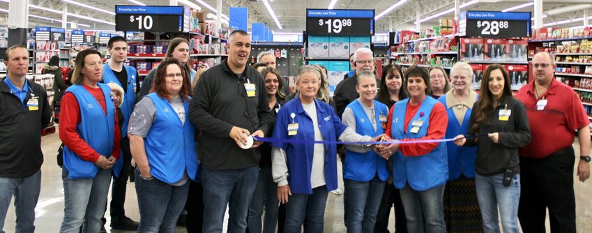 Walmart Supercenter in West Plains held its grand reopening Friday with a ribbon-cutting ceremony, with store management and other employees in attendance, plus a slate of special events and giveaways throughout the day to celebrate the recent remodel. Store Manager James Melvin thanked the community for its patience during the monthslong remodel. Among the completed projects are a rearrangement of merchandise, and a new pharmacy, bakery, restrooms and shopping carts. From left, holding and behind the ribbon: Melvin; the store's longest-term employees who have been there since its previous location, Cathy Joyner, Beverly Vandiver and Debra Rigel; and Store Lead Jennifer Day.