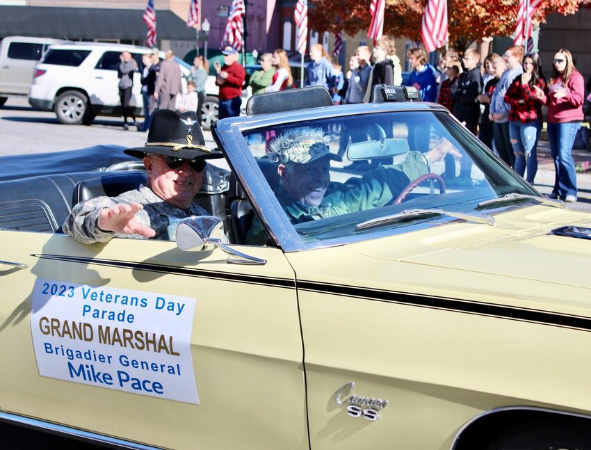 Retired Army National Guard Brigadier General Mike Pace, West Plains, served as the grand marshal for this year's Veterans Day parade, held Friday in downtown West Plains. During his military career, Pace earned many distinctive honors, and at one point was the joint force land component commander, in operations control commanding all Army units of the Missouri National Guard. He is a Bronze Star recipient who retired from military service in 2008, and during his service also was employed for about 33 years with the Missouri State Highway Patrol, achieving the rank of major and retiring as director of the criminal investigation bureau in Jefferson City. He is being driven along the parade route by the owner of the classic Camaro in which he is riding, Tillman Durham. Watch Wednesday's Quill for more parade pictures.