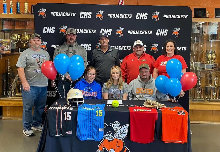 ALEXIS EGGEMEYER, seated center, an outfielder from Chester, Ill., recently signed a national letter of intent to play for the Missouri State University-West Plains (MSU-WP) Grizzly Softball team beginning in fall 2024. With Eggemeyer above are family members and high school coaches including, seated left, Lisa Tindall and, seated right, Jamieson Eggemeyer; standing from left, David Tindall, Patt Preusser, John Ruessler, Chad Todaro and Carrie Lutman.
