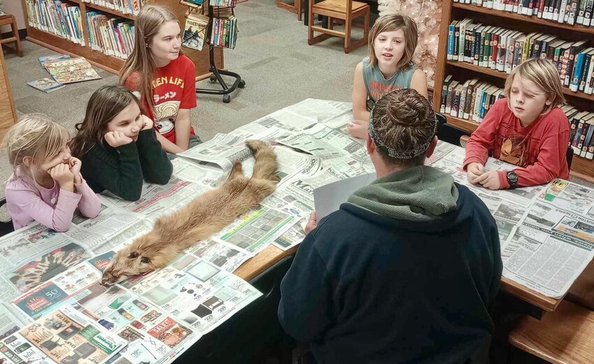Wendy Lott, center, with the Missouri Department of Conservation Twin Pines Conservation Education Center in Winona recently made a special&nbsp;visit to Summersville Branch Library. While there, she read a book to children present and answered their questions about red foxes. Together, Lott and the children worked to make red fox Christmas tree ornaments from natural materials. The children enjoyed the visit, said Librarian Kathie Cox, who added she also enjoyed the visit.
