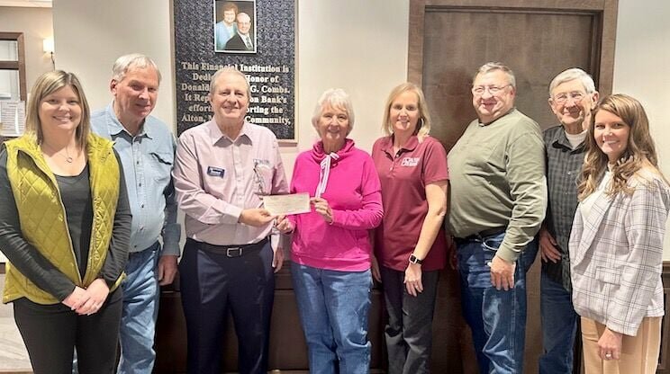 A $65,000 donation made by the Alton Bank and employees, and members of the Combs family, will be used to help the Alton Multipurpose Senior Center either purchase a larger facility or expand and improve upon its current one. The funds were given in memory of Donald Combs, an Alton High School graduate who died in 2019, and in honor of Alice Combs, a graduate of Couch School. From left: Alton Bank employees Sara Wheeler and Barry Barnes, President Randall G. Combs, Sandra Dills, bank employee Kari Bowers, senior center board member Richard Todd, Tom Dills, and bank employee Lauren McEntire.