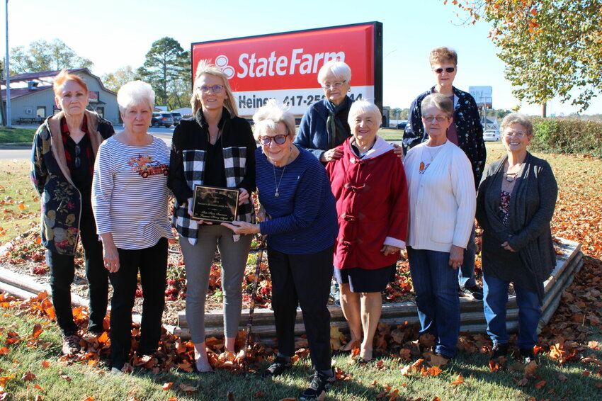 The Rambling Rose Garden Club awarded its 2023 Business Beautification Award to Ramona Heiney State Farm Insurance for her flower bed planted with red geraniums. The color choice represents the State Farm logo and Heiney's ties to both the Glenwood Mustangs and West Plains Zizzers. The flowers had succumbed to cold weather by the time this picture was taken, but Heiney has since replaced the geraniums with icicle pansies. From left: Rambling Rose Garden Club Treasurer Margie Riel and Vice President Barbara Butler, Heiney, Rambling Rose Garden Club President Ruth Edgeller and members Akemi Anders, Judy Norton, Sandra Riley, Diane Scherff, and Rambling Rose Garden Club Secretary Judy McGoldrick.