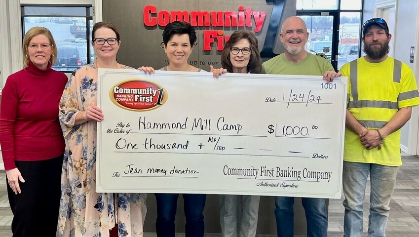 Community First Banking Company employees pay to wear jeans on Fridays and, each quarter, choose a charity to support with the proceeds raised. For the fourth quarter of 2023, bank staff chose to contribute to the Hammond Mill Camp Capital Improvement Campaign with a donation of $1,000.&nbsp;The capital improvement fundraising campaign kicked off in 2023 in celebration of the camp&rsquo;s 75th anniversary. Hammond Mill Camp is located west of West Plains on CC Highway and offers a place for summer youth camps, weddings and family reunions. Operated by a board of directors, the camp has seen facility upgrades over the last year. Work continues as the camp moves toward its $160,000 fundraising goal. Find updates on Facebook, @hammondmill.camp. Donations can be made by mailing a check to the Board Of Directors at 139 Hammond Mill Drive, Pottersville, MO 65790, or going online to the nonprofit&rsquo;s PayPal account at paypal.me/HMCamp65790. From left: Community First employees Kelly Slayton, Lyndsay Sellars and Ruth Li-Whittington, and Hammond Mill Camp Board members Robin Mustion, Thad White and Jacob Schmitt.