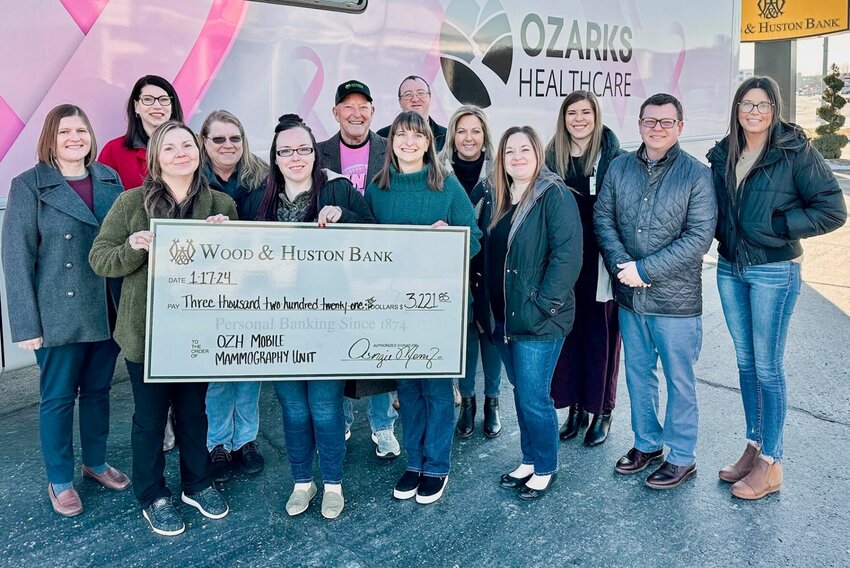 Employees of Wood &amp;amp; Huston Bank in West Plains joined forces to raise $3,221.85 for the Ozarks Healthcare Mobile Mammography Unit. The initiative, driven by bank employees, represents a shared commitment to women's health in the region. Wood &amp;amp; Huston Bank presented the collected funds to members of the Ozarks Healthcare Foundation Board of Directors.