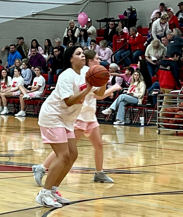 Lady Zizzer Delani Wahome warms up for the varsity game.