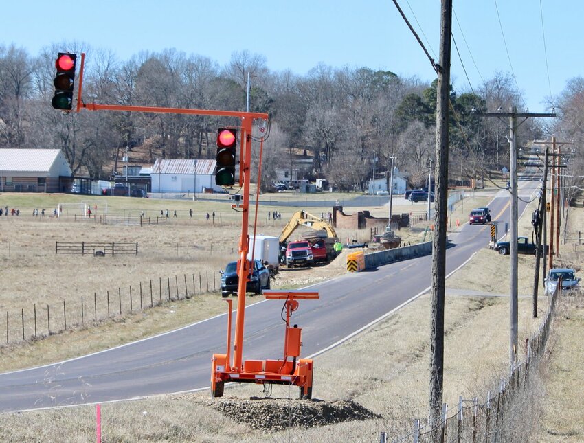 Temporary traffic lights have been erected on east U.S. 160 near West Plains Elementary School, seen in the background of this photo, while Missouri Department of Transportation crews begin a monthslong project to replace culverts and add a southbound turn lane at the intersection with BB Highway. U.S. 160 has been reduced to one lane with a 10-foot width restriction with work anticipated to wrap up Oct. 1, said MoDOT officials. The temporary traffic signals are located near County Roads 2570 and 2730 and will guide traffic through the work zone, which is also marked with signs. Drivers should travel through the area with extreme care. For more information, call Resident Engineer Audie Pulliam at 417-469-2589 or MoDOT&rsquo;s Customer Service line at 888-ASK-MODOT (888-275-6636), or go online to www.modot.org/southeast.