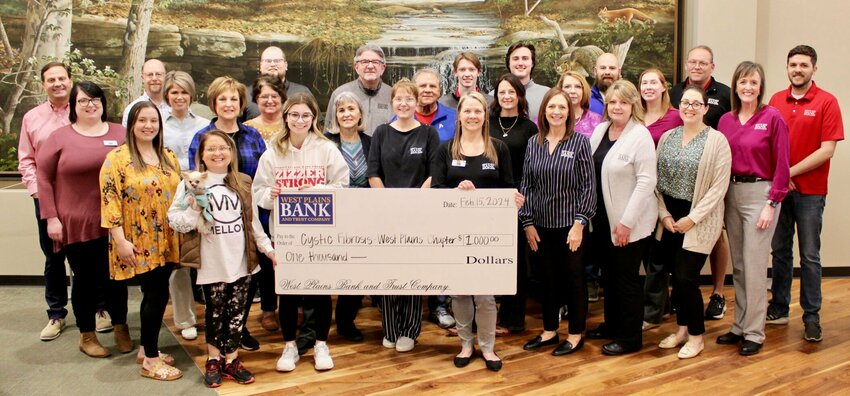West Plains Bank and Trust Company continues a longstanding tradition of supporting research into cures and treatments for cystic fibrosis with a $1,000 donation ahead of the March 16 Cystic Fibrosis Music Concert featuring Missouri native country musician Sara Evans. Cystic fibrosis is a genetic condition affecting the respiratory and digestive systems, and there is no cure. Holding the check are Cystic Fibrosis volunteer Kaigan Barker, left, and West Plains Bank and Trust Human Resources Director Angie Temple.