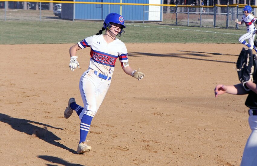 SOPHOMORE KENZIE MASSEY, Grandby, led the Grizzly Softball team to a 12-1 win in the second game of a doubleheader against Arkansas State University-Newport Feb. 24 in Newport. Here, she heads for third base during a recent home game at Hilburn Sports Complex. (MSU-WP Photo)
