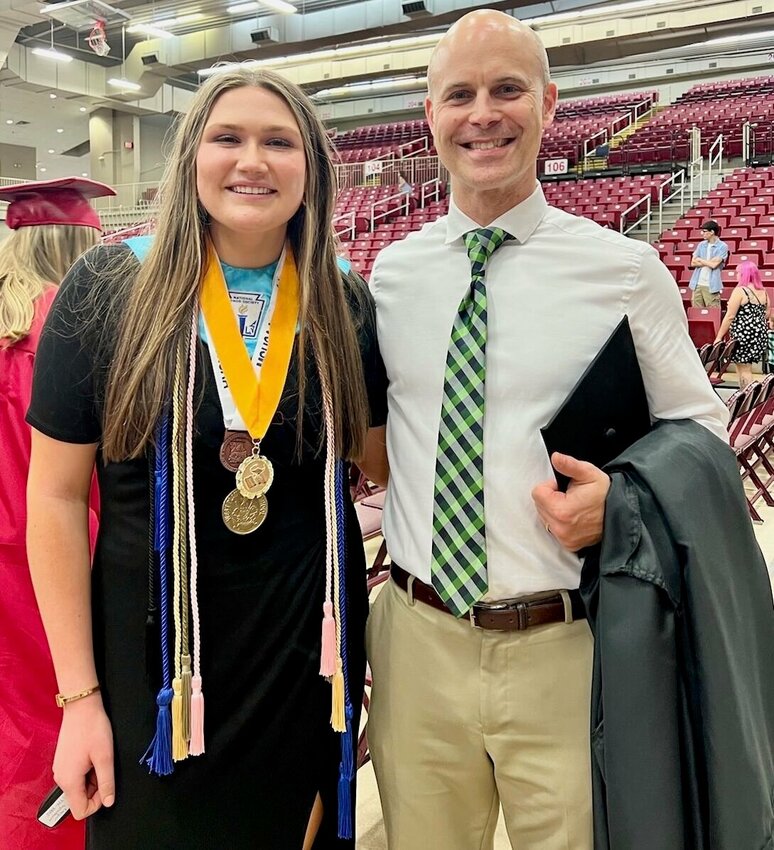 Zizzer alumna Madylin Cooper, Class of 2022, left, is a former Project Lead the Way (PLTW) biomedical student who was asked to continue an independent project, which she developed at West Plains High School, as a student at Clemson University. With her is Nathan Fleming, a West Plains High School teacher and PLTW instructor, and 2022 recipient of a National Outstanding Teacher award for PLTW. He will present PLTW at a national showcase Thursday.
