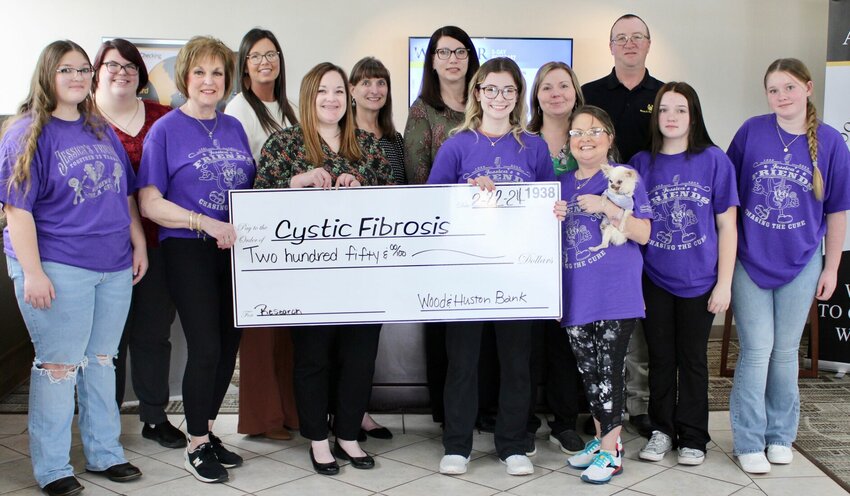 Wood &amp;amp; Huston Bank has donated $250 towards this year's cystic fibrosis fundraising concert, to be held 7 p.m. Saturday at the West Plains Civic Center, 110 St. Louis St. Tickets to the event are sold out, organizers announced Thursday. Doors open at 5 p.m. and Evans' performance will follow silent and live auctions and the opening act Jessica's Friends. Front row, from left: Cystic Fibrosis of West Plains volunteers Katlyn Johnson and Lois Frazier, Wood &amp;amp; Huston Bank employee Ashley Young and volunteers Kaigan Barker, Jessica Joice-Frazier, Nevaeh Johnson and Bella Johnson. Back row: Wood &amp;amp; Huston Bank employees Zoe Mahoney, Brittany Smith, Andy Tripp, Karen Eggert, Shauna Lockett and Kent Kelley.