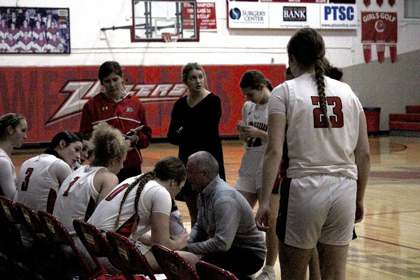 WPHS Lady Zizzers Head Coach, Scott Womack, huddles with his team during the last timeout of the final home game of the 2024 season.