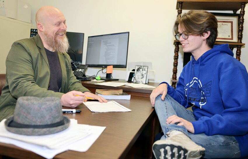 Shane Hull, right, visits with his adviser, Assistant Professor Alex Pinnon, about the requirements he needs to fulfill for graduation in May.