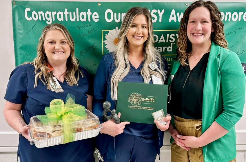 Samantha &ldquo;Sam&rdquo; Kintner, a licensed practical nurse in Ozarks Healthcare&rsquo;s Medical Surgery (Med/Surg) Department, center, is the latest to receive the Daisy Award for Extraordinary Nurses at Ozarks Healthcare. Celebrating with her are Med/Surg Manager Kaitlin Caldwell, left, and Chief Nursing Officer Lacey Carter.