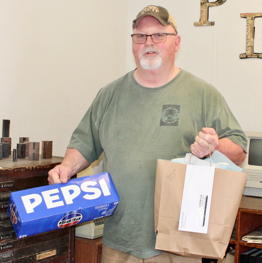 Rick Pliler, West Plains, is the winner of the Quill's Big Game football trivia contest, and recently stopped by to pick up his prize package. Pliler's entry was chosen at random from among those contestants who answered trivia questions correctly. The prizes, provided by contest sponsors, were two cases of Pepsi products, items from T-B-N Electrical Supply, two Little Caesars pizzas and a $50 Richards Brothers Feed Store gift certificate.