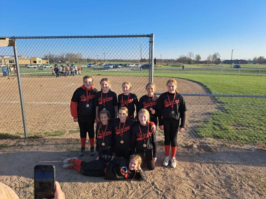 The Dora Falcons proudly wearing their 2nd place medals at the Lebanon Softball Tournament. Front and center is Paisley Wray. First row, from left: Jaiden Pampering, Brynlee Rogers, and Brylee Jackson. Second row: Reagan Emory, Anistyn Neldon, Collins Pipkin, Amerie Fox, and Brylee Vanranken.