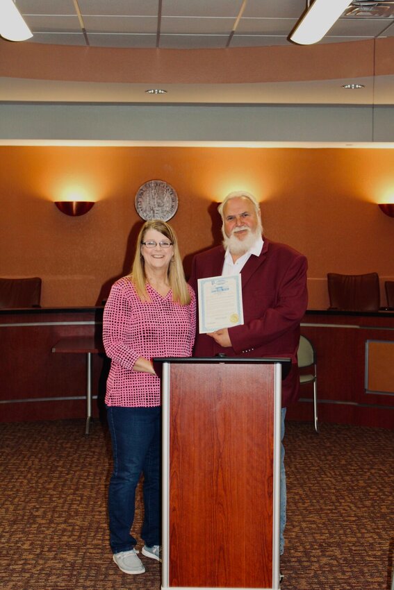 West Plains Mayor Mike Topliff, right, presents Kenya Cook of Christos House with a proclamation recognizing April as Sexual Assault Awareness Month.