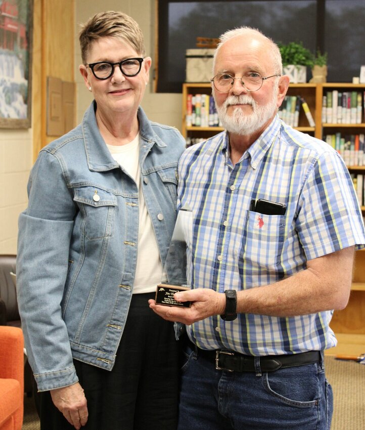 The West Plains R-7 School Board, during its regular monthly meeting Tuesday, expressed appreciation for the service of outgoing president Jim Thompson, right, who recently lost his bid for reelection to Shealia Harper. Thompson made a statement before the board recounting his experience and was presented a cake and a memento commemorating his 36 years of service before Harper and re-elected board member Brian Mitchell were sworn in and the board was reorganized. Former Vice President Cindy Tyree, left, was appointed president.