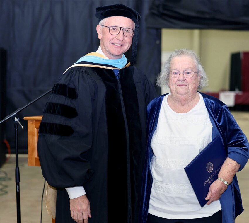 Margaret Keister, West Plains, former manager of Brill Title Company, right, received an honorary Associate of Arts in General Studies degree Saturday from Missouri State University-West Plains during commencement ceremonies. MSU-WP Chancellor Dennis Lancaster presented the degree.