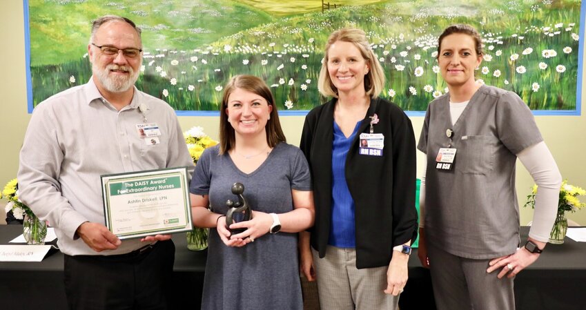 From left, interim Texas County Memorial Hospital CEO Bill Bridges presents Willow Springs nurse Ashtin Driskell with the Daisy Award. They are joined by Courtney Owens, chief nursing officer, and Shelly Hawkins, medical surgical director.